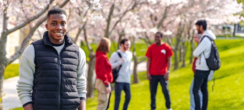 Student smiling at the camera