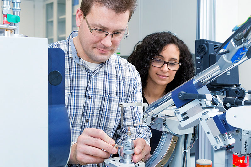 A professor with a research student.