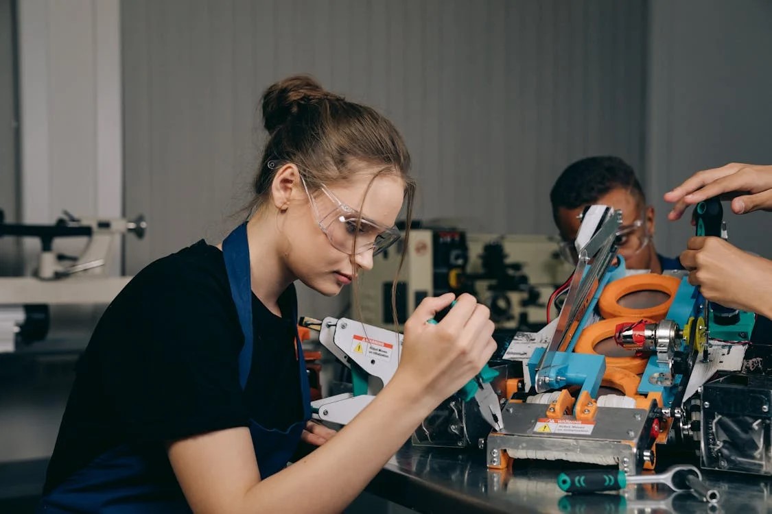 a student building machinery equipment