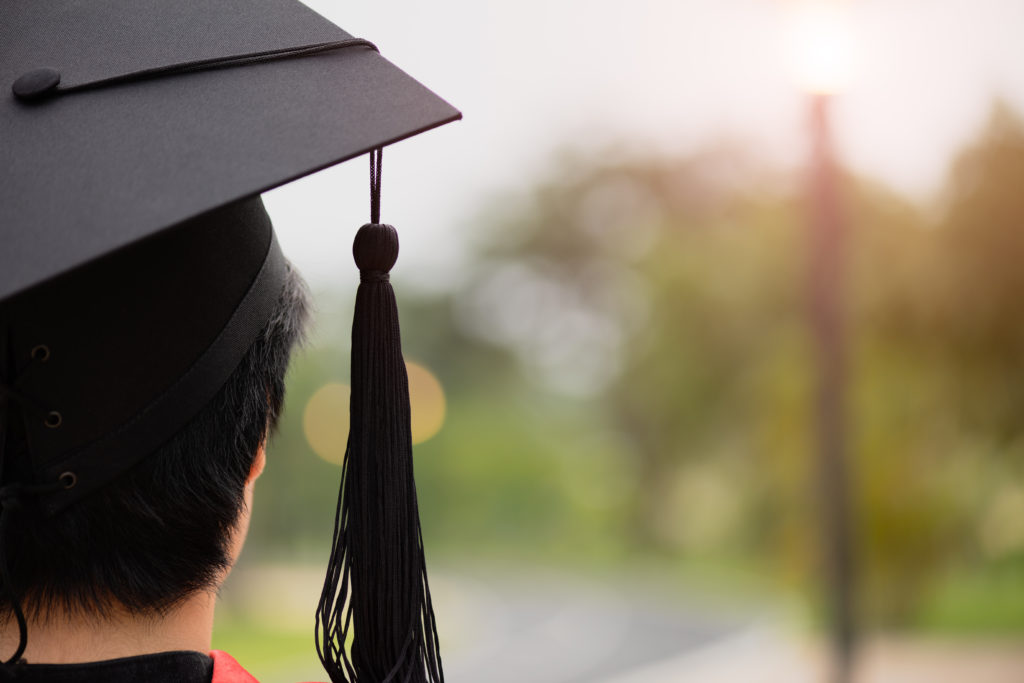 person in grad cap looking forward