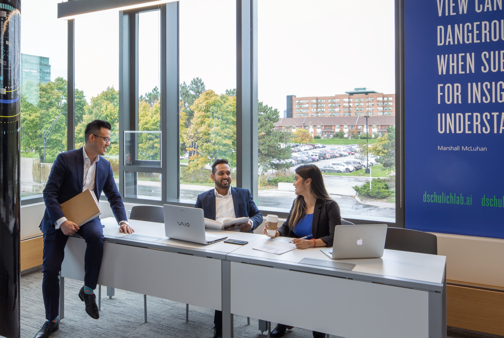 business students sitting and having a conversation
